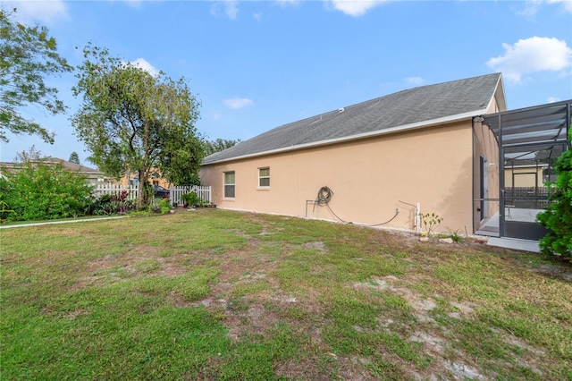 view of yard featuring a lanai