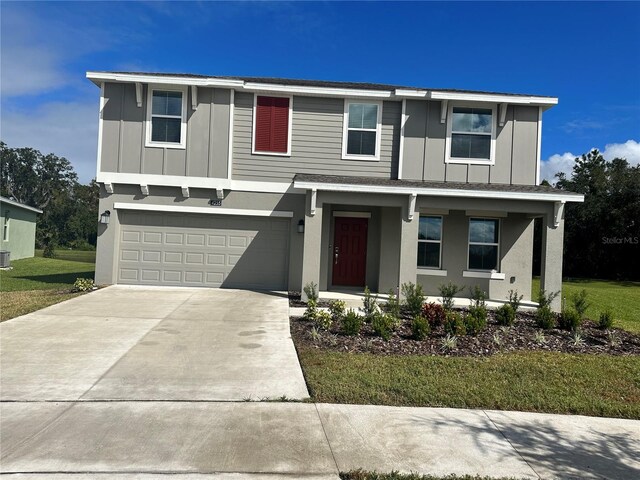 view of front facade featuring a garage and a front yard