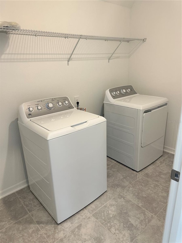 washroom featuring independent washer and dryer