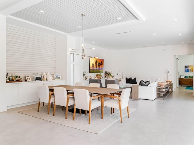 dining space with an inviting chandelier