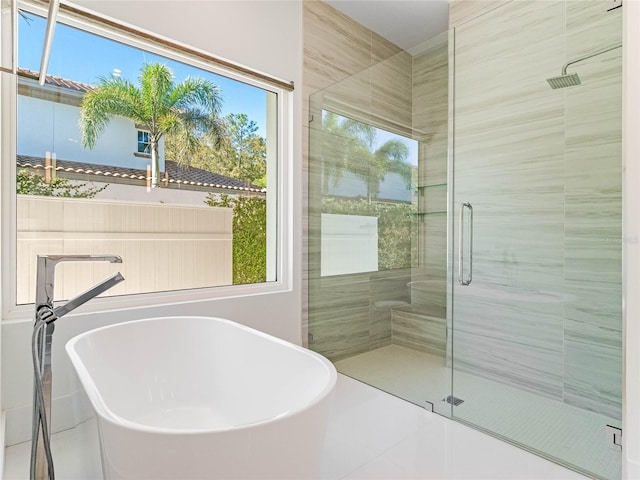 bathroom with sink, tile patterned flooring, and shower with separate bathtub