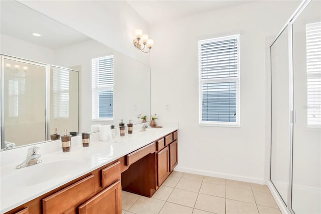 bathroom with tile patterned flooring, vanity, and an enclosed shower