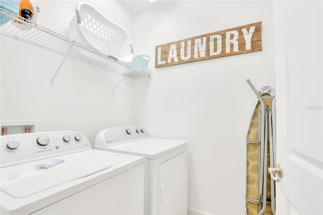 laundry area with independent washer and dryer