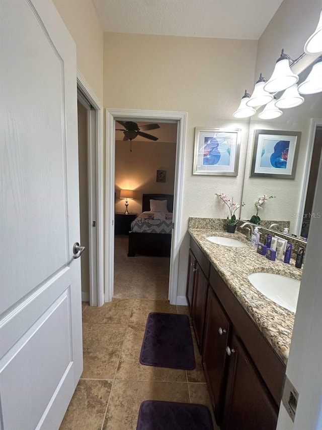 bathroom featuring ceiling fan, tile patterned flooring, and vanity