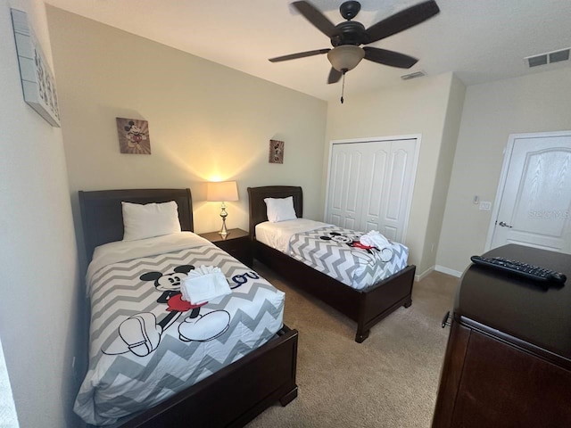 bedroom featuring ceiling fan, carpet floors, and a closet