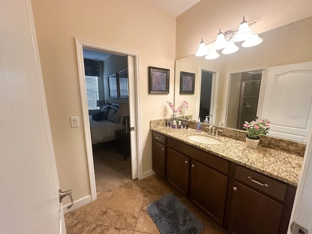 bathroom featuring vanity and a shower with shower door