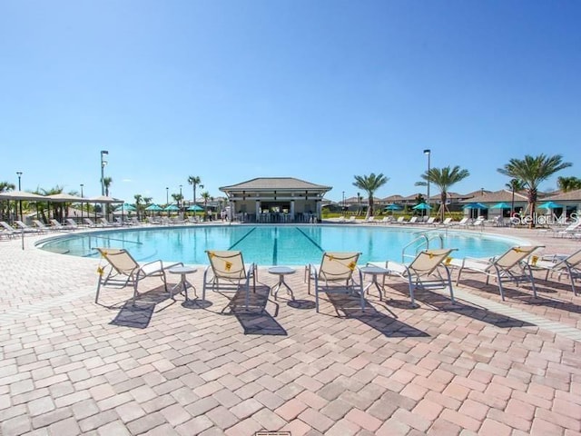 view of swimming pool featuring a patio area