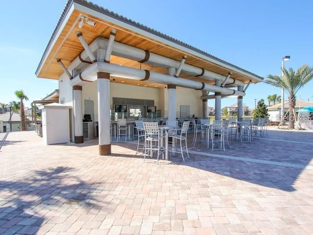 exterior space featuring an outdoor bar