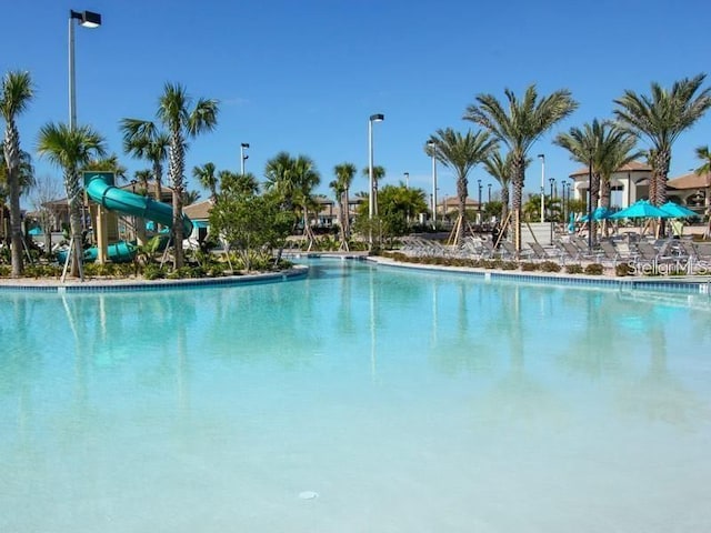 view of swimming pool featuring a water slide