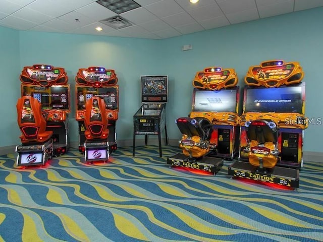 game room featuring carpet flooring and a paneled ceiling