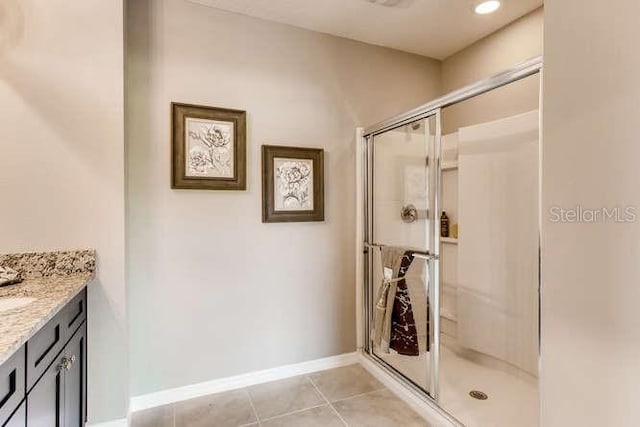 3475 Sandalwood Isle Way, Ocoee, FL 34761 - full bath featuring vanity, a shower stall, and tile patterned floors