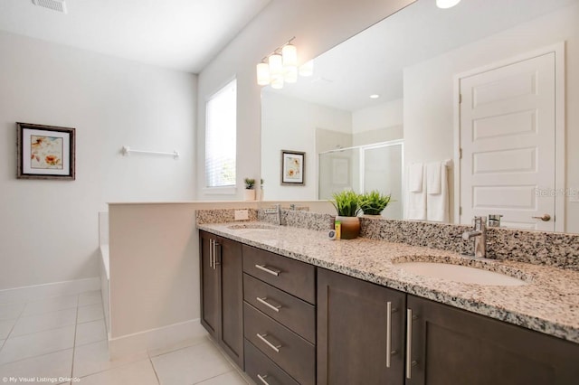 bathroom with independent shower and bath, vanity, and tile patterned flooring