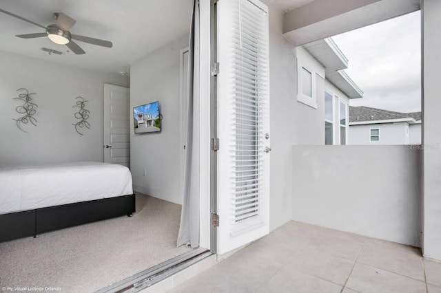 tiled bedroom with ceiling fan