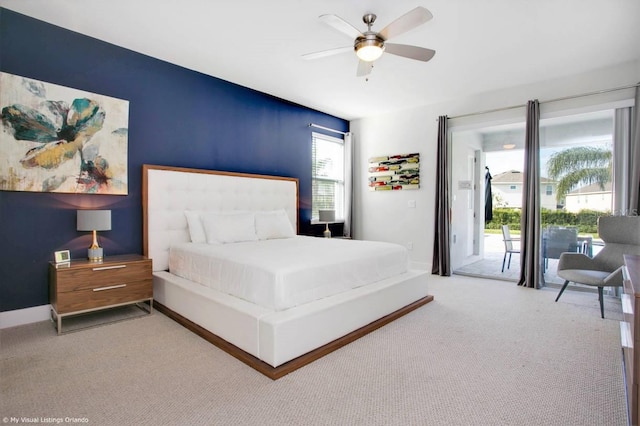 bedroom featuring access to outside, ceiling fan, and carpet