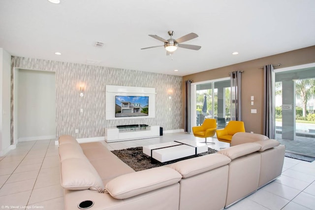 tiled living room with ceiling fan