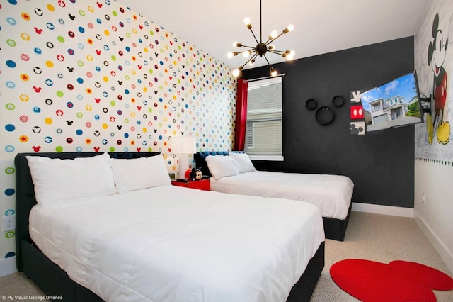 carpeted bedroom featuring a chandelier