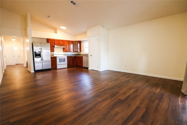 kitchen with lofted ceiling, sink, white electric stove, stainless steel fridge, and dark hardwood / wood-style flooring