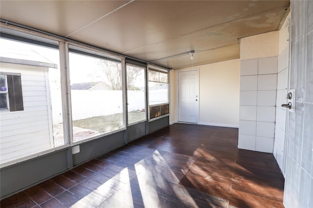 unfurnished sunroom with plenty of natural light