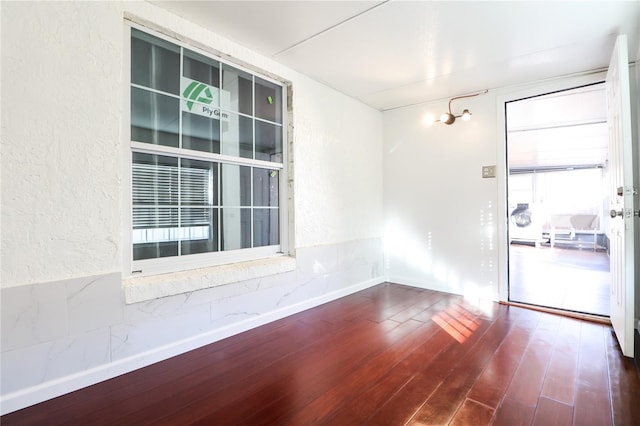 empty room featuring wood-type flooring