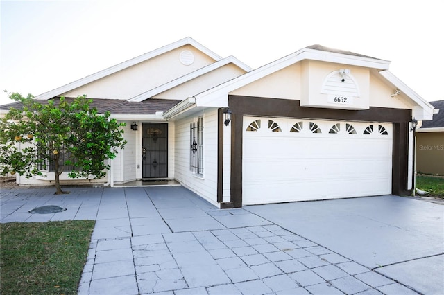 single story home with a garage