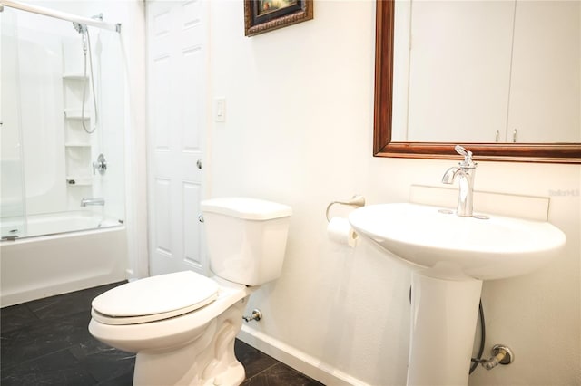 bathroom with shower / bath combination with glass door, tile patterned floors, and toilet