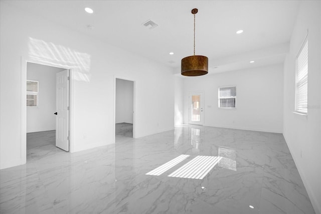 spare room featuring recessed lighting, marble finish floor, and visible vents