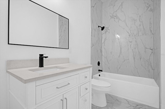 bathroom featuring toilet, marble finish floor, bathtub / shower combination, and vanity