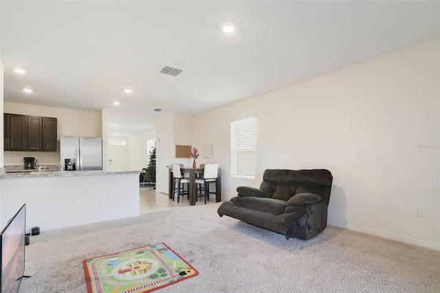 living room with light colored carpet