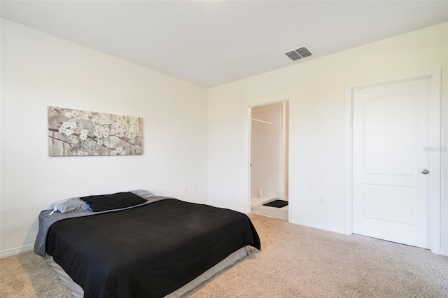 carpeted bedroom featuring connected bathroom