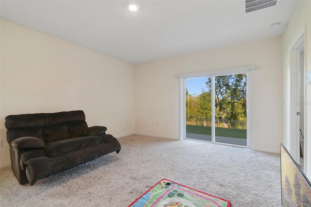 living area with light carpet