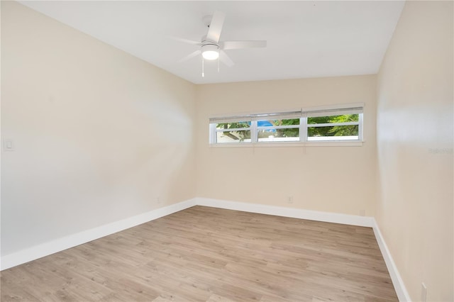 unfurnished room featuring light wood-type flooring, lofted ceiling, and ceiling fan