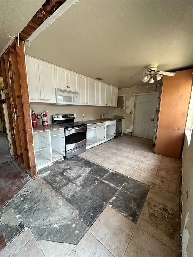 kitchen with white cabinetry, stainless steel appliances, ceiling fan, and sink