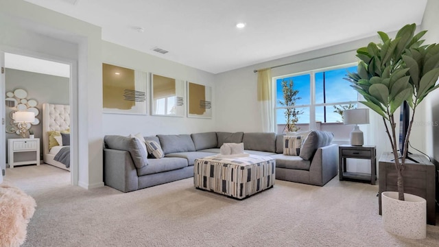 living room featuring light carpet