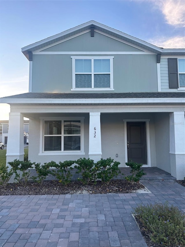 view of front of property featuring covered porch