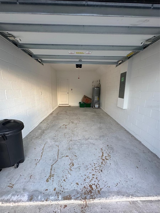 garage with electric panel, water heater, and a garage door opener