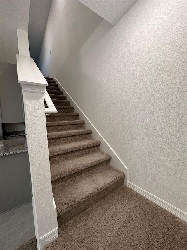 staircase with carpet