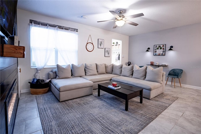 tiled living room with ceiling fan