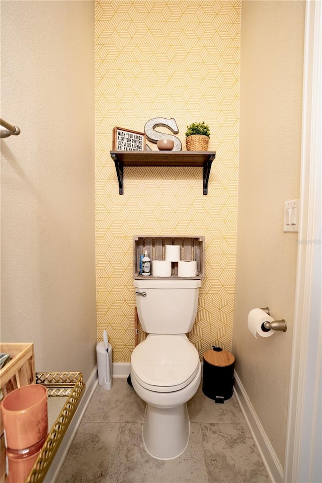 bathroom with tile patterned floors and toilet