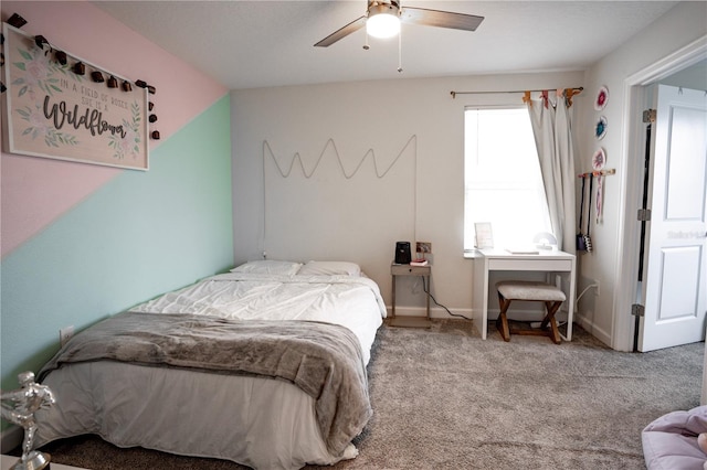 carpeted bedroom featuring lofted ceiling and ceiling fan