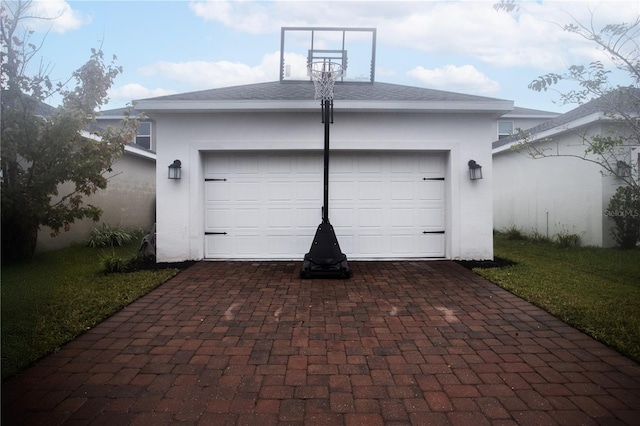 garage featuring a yard