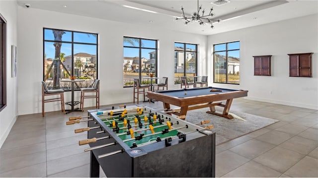 recreation room featuring a healthy amount of sunlight, light tile patterned floors, and pool table