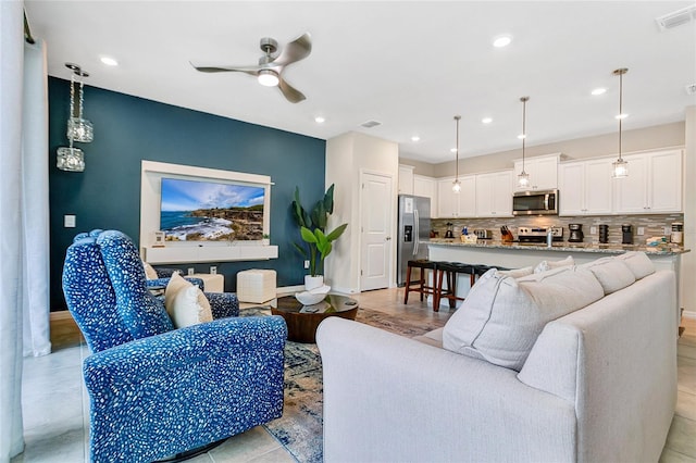 living room with ceiling fan