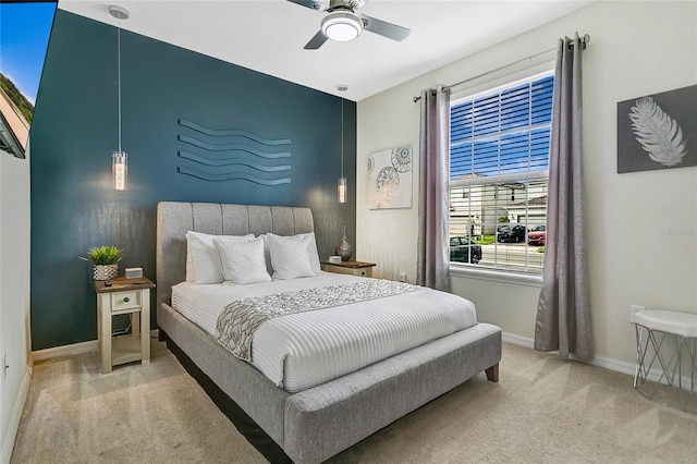 bedroom with light carpet and ceiling fan