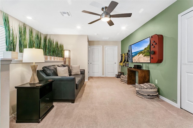 living room featuring light carpet and ceiling fan