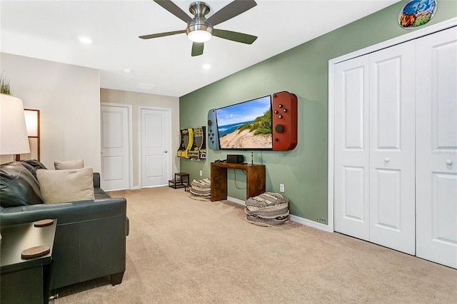 living room featuring light carpet and ceiling fan