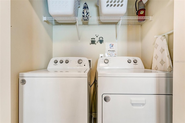 laundry room featuring washing machine and dryer