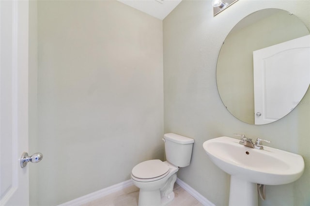 bathroom featuring toilet and sink