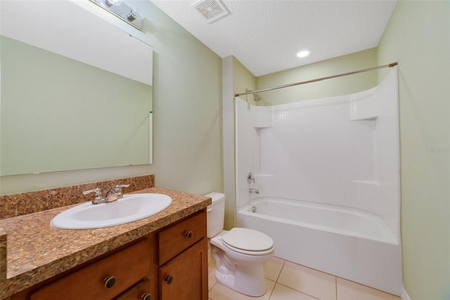 full bathroom with tile patterned floors, vanity, a textured ceiling, shower / washtub combination, and toilet