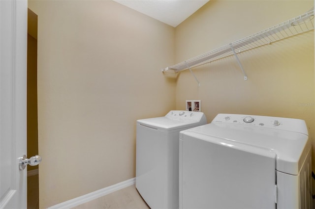 washroom with washer and dryer