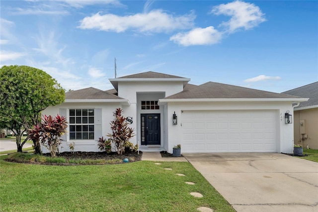 view of front facade featuring a front yard and a garage